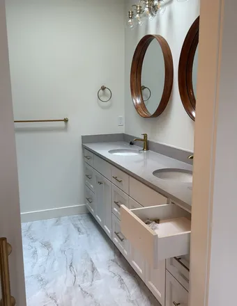Bathroom vanity with soft white painted walls